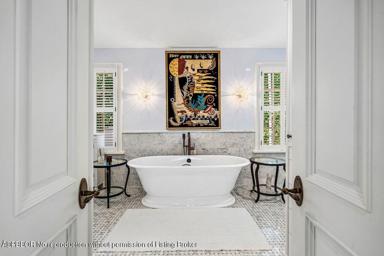 168 Kings Road Palm Beach, FL 33480 - Photo 14 of 30 a bathroom with a sink and a mirror