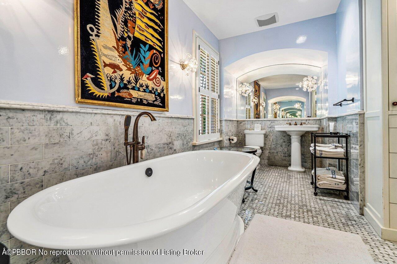 168 Kings Road Palm Beach, FL 33480 - Photo 15 of 30 a bathroom with a bathtub and a sink