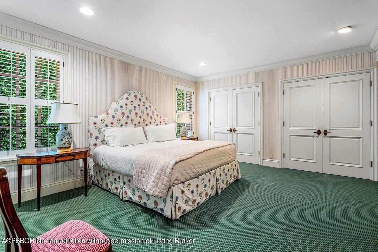 168 Kings Road Palm Beach, FL 33480 - Photo 16 of 30 a bedroom with a bed and a window