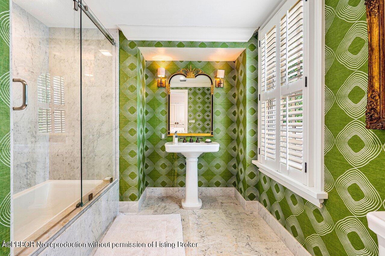 168 Kings Road Palm Beach, FL 33480 - Photo 17 of 30 a bathroom with a bathtub and a shower