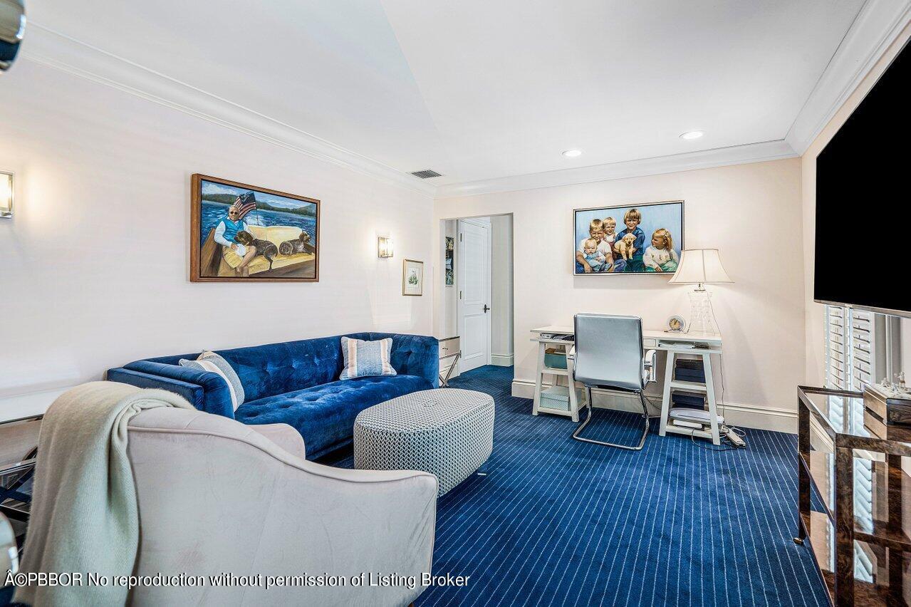 168 Kings Road Palm Beach, FL 33480 - Photo 18 of 30 a living room with furniture and a flat screen tv