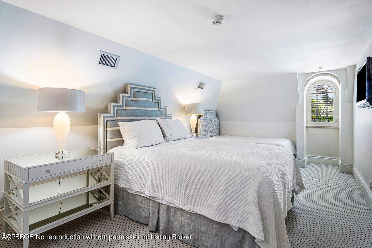 168 Kings Road Palm Beach, FL 33480 - Photo 20 of 30 a bedroom with a bed and a window