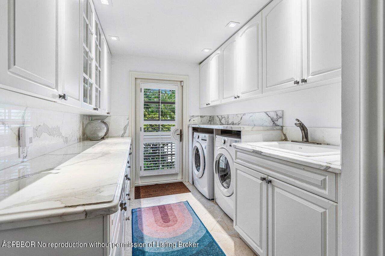 168 Kings Road Palm Beach, FL 33480 - Photo 22 of 30 a utility room with dryer and washer