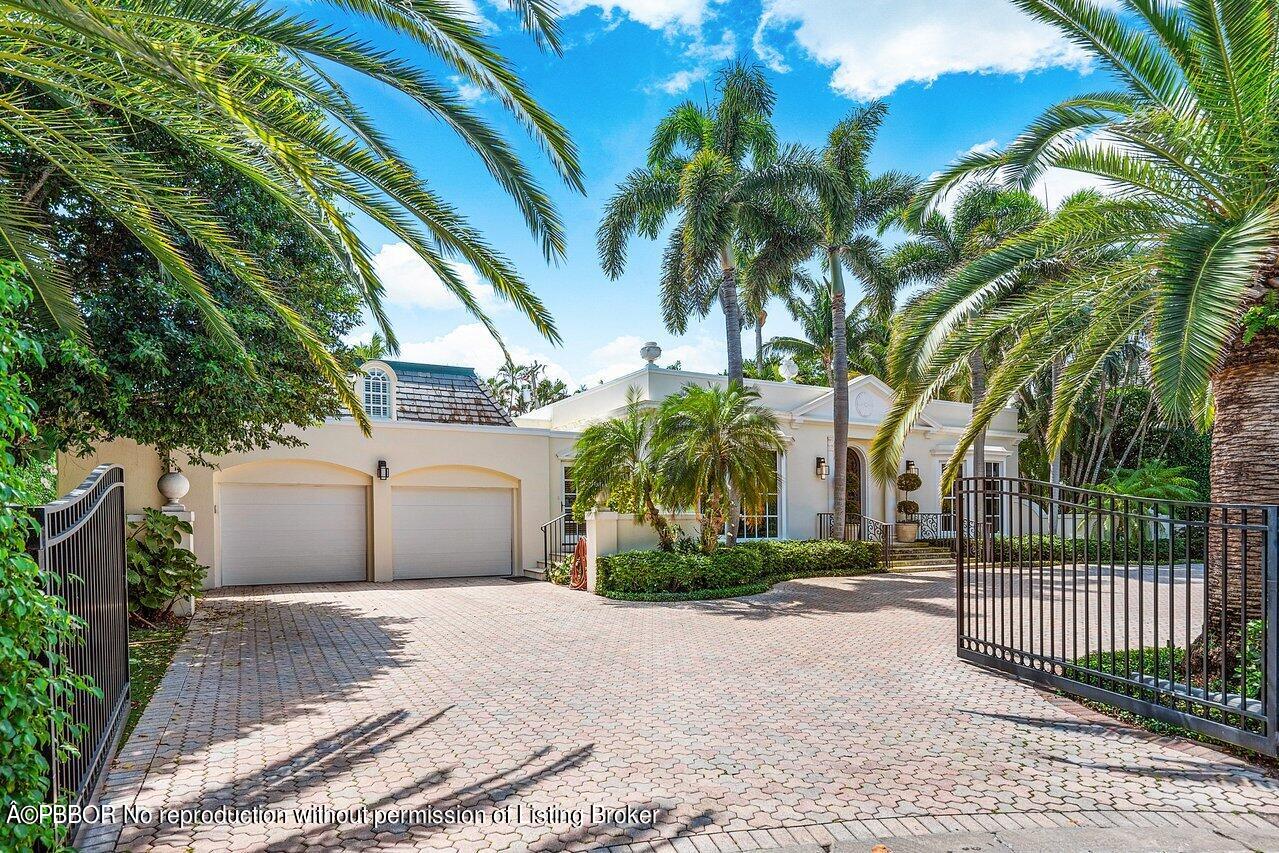 168 Kings Road Palm Beach, FL 33480 - Photo 28 of 30 a view of a house with a yard and potted plants
