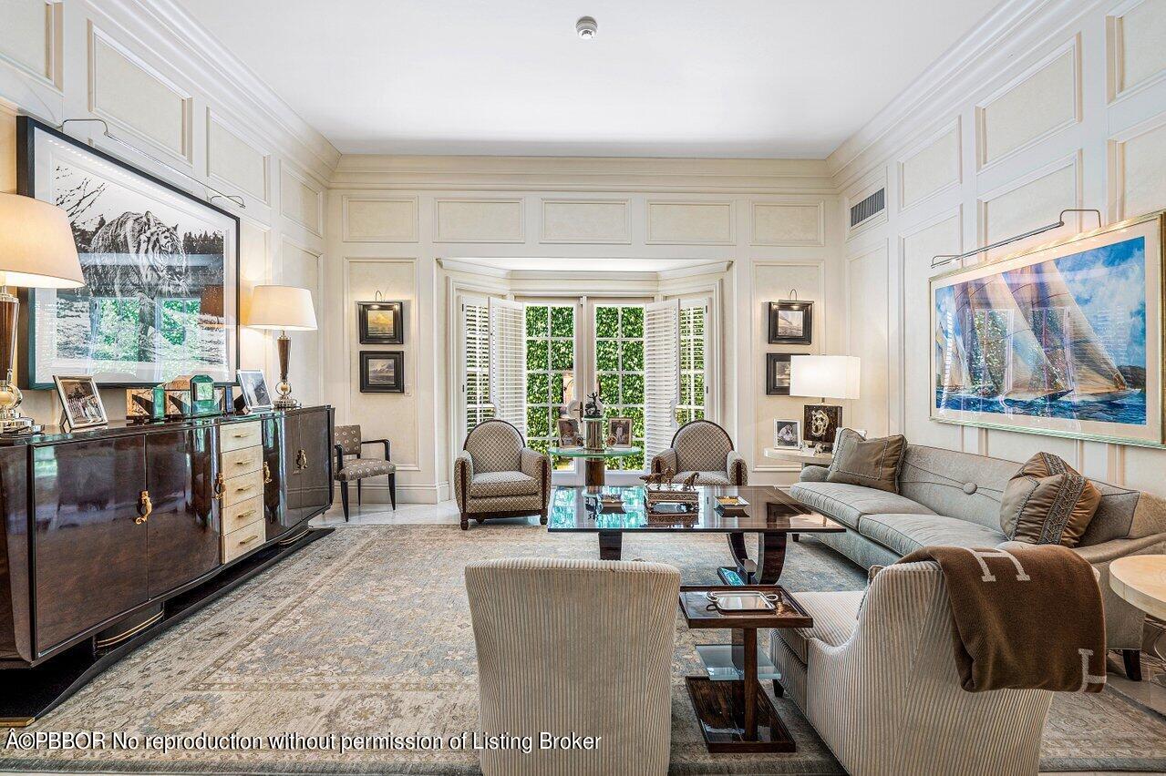 168 Kings Road Palm Beach, FL 33480 - Photo 4 of 30 a living room with furniture and large windows