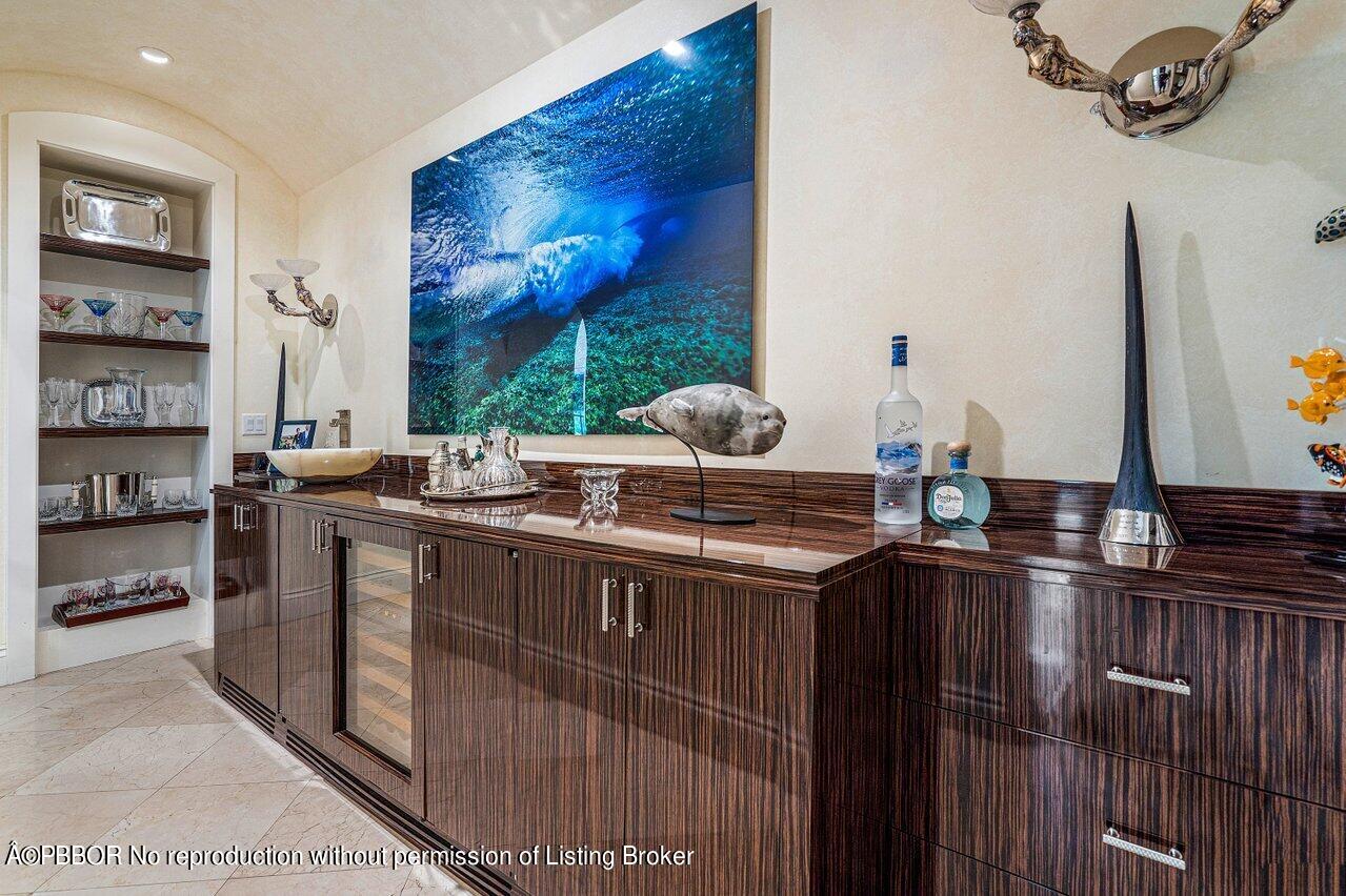 168 Kings Road Palm Beach, FL 33480 - Photo 5 of 30 a kitchen with stainless steel appliances a sink and a refrigerator