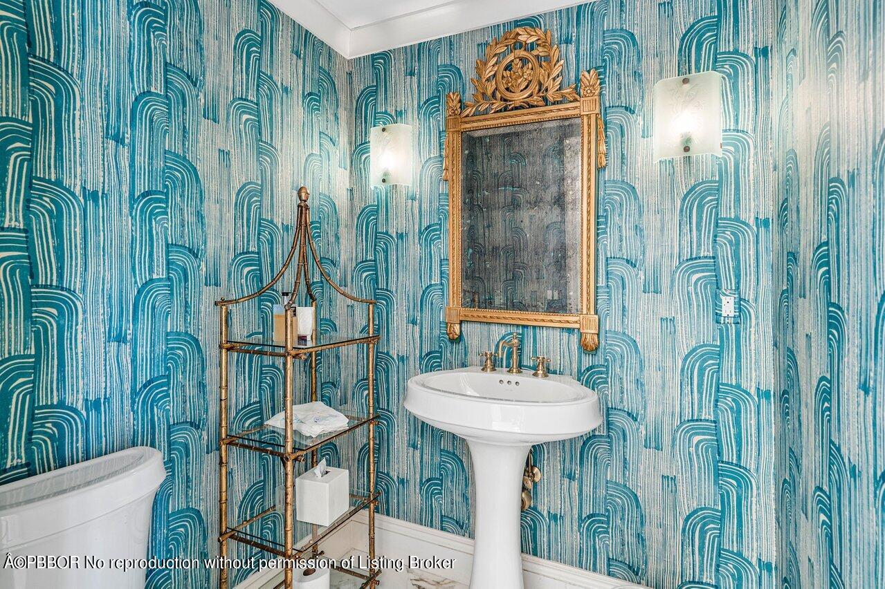 168 Kings Road Palm Beach, FL 33480 - Photo 7 of 30 a bathroom with a sink and mirror