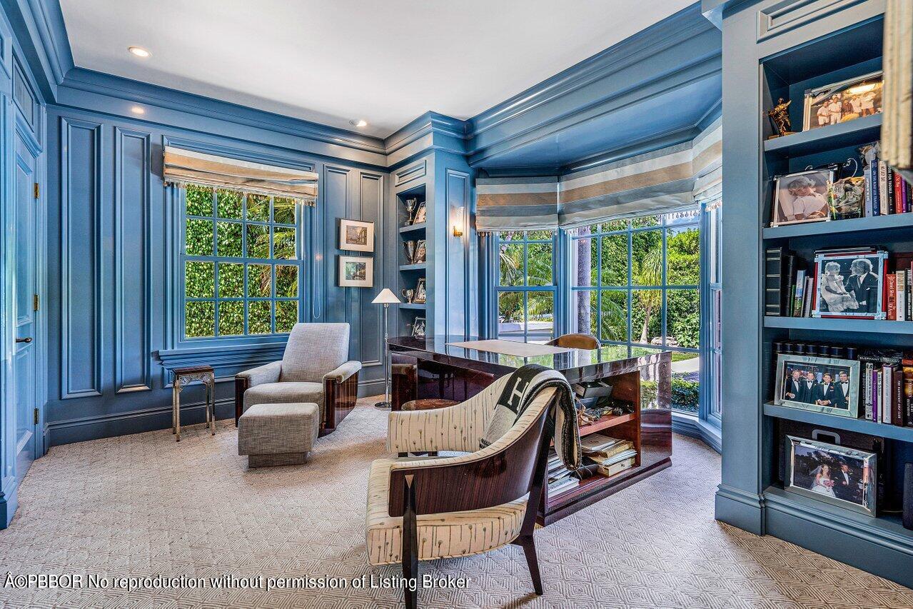 168 Kings Road Palm Beach, FL 33480 - Photo 8 of 30 a living room with furniture and a book shelf