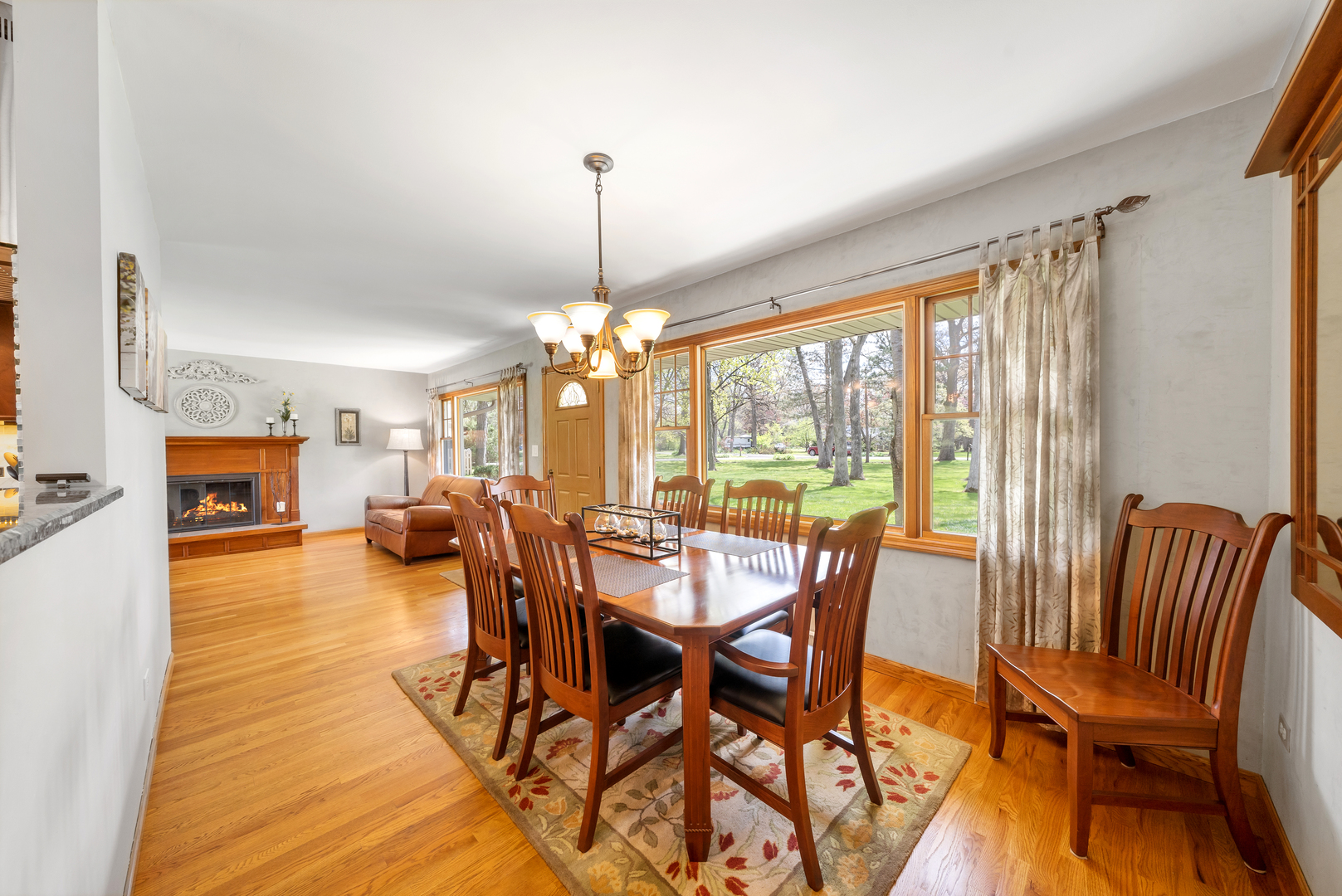 43W640 Thornapple Tree Road Sugar Grove, IL 60554 - Photo 9 of 32 a view of a dining room with furniture window and wooden floor
