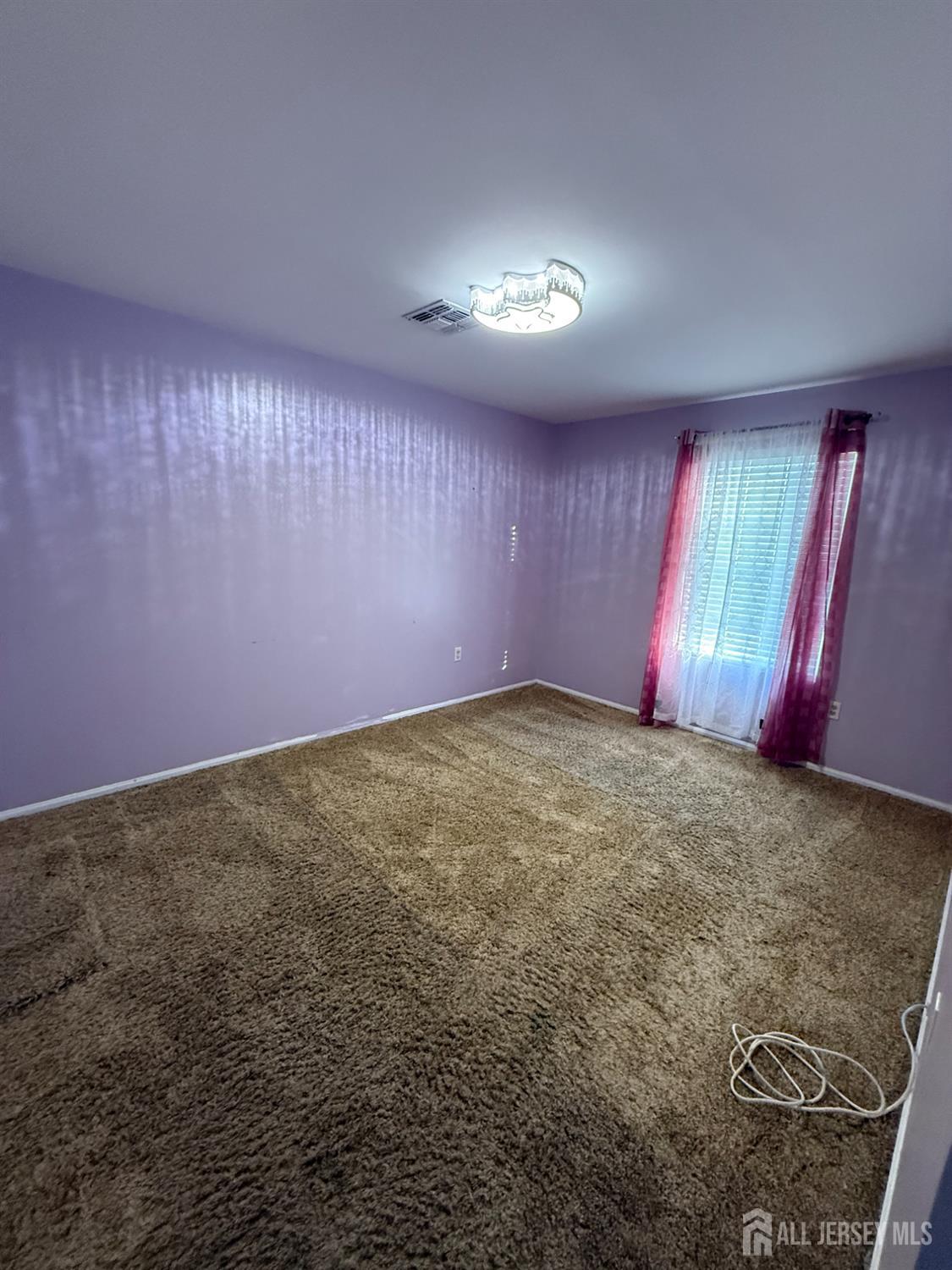 31 Beverly Street, Unit 2ND F Carteret, NJ 07008 - Photo 17 of 20 an empty room with windows