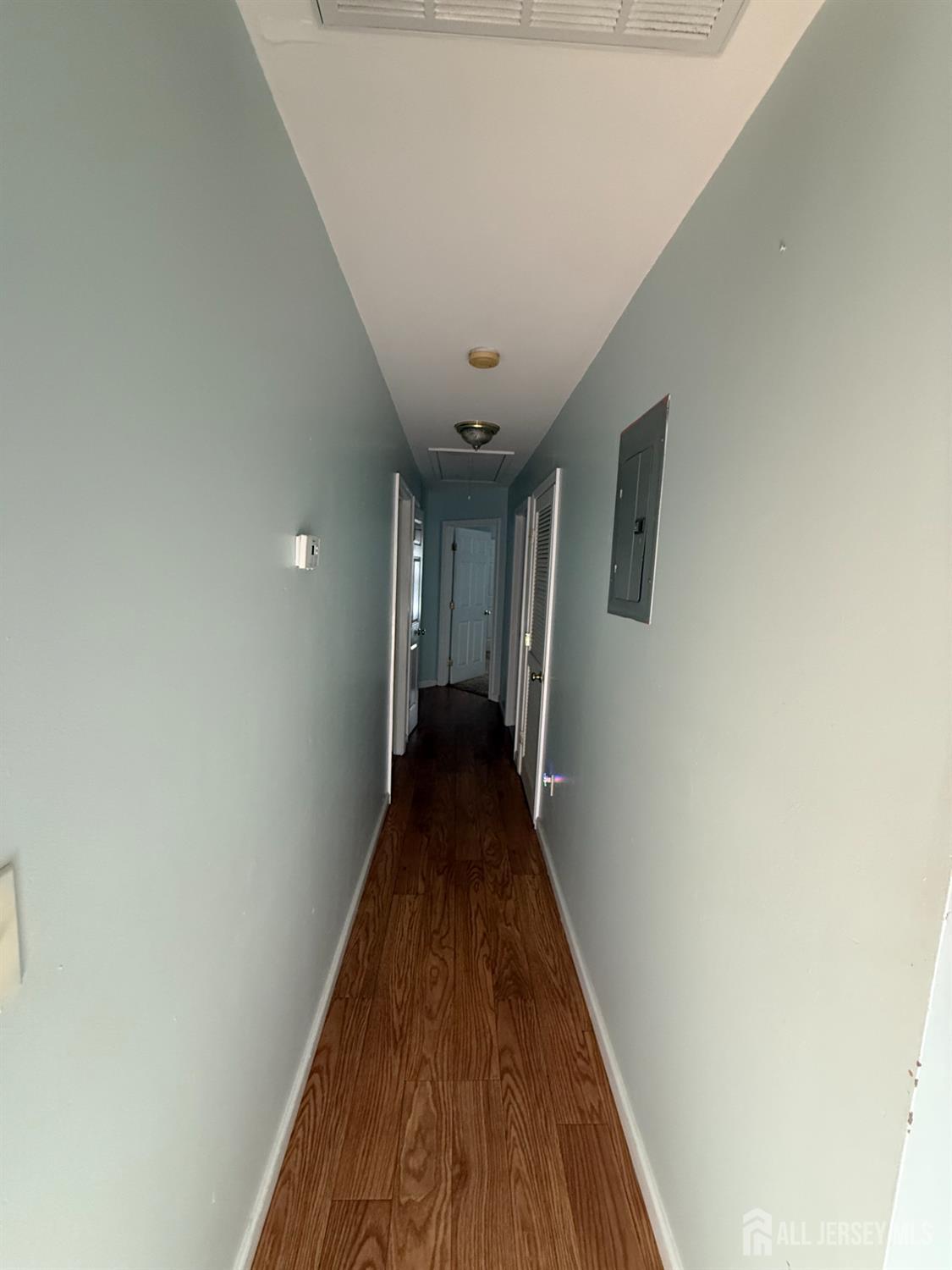 31 Beverly Street, Unit 2ND F Carteret, NJ 07008 - Photo 8 of 20 a view of a hallway with wooden floor