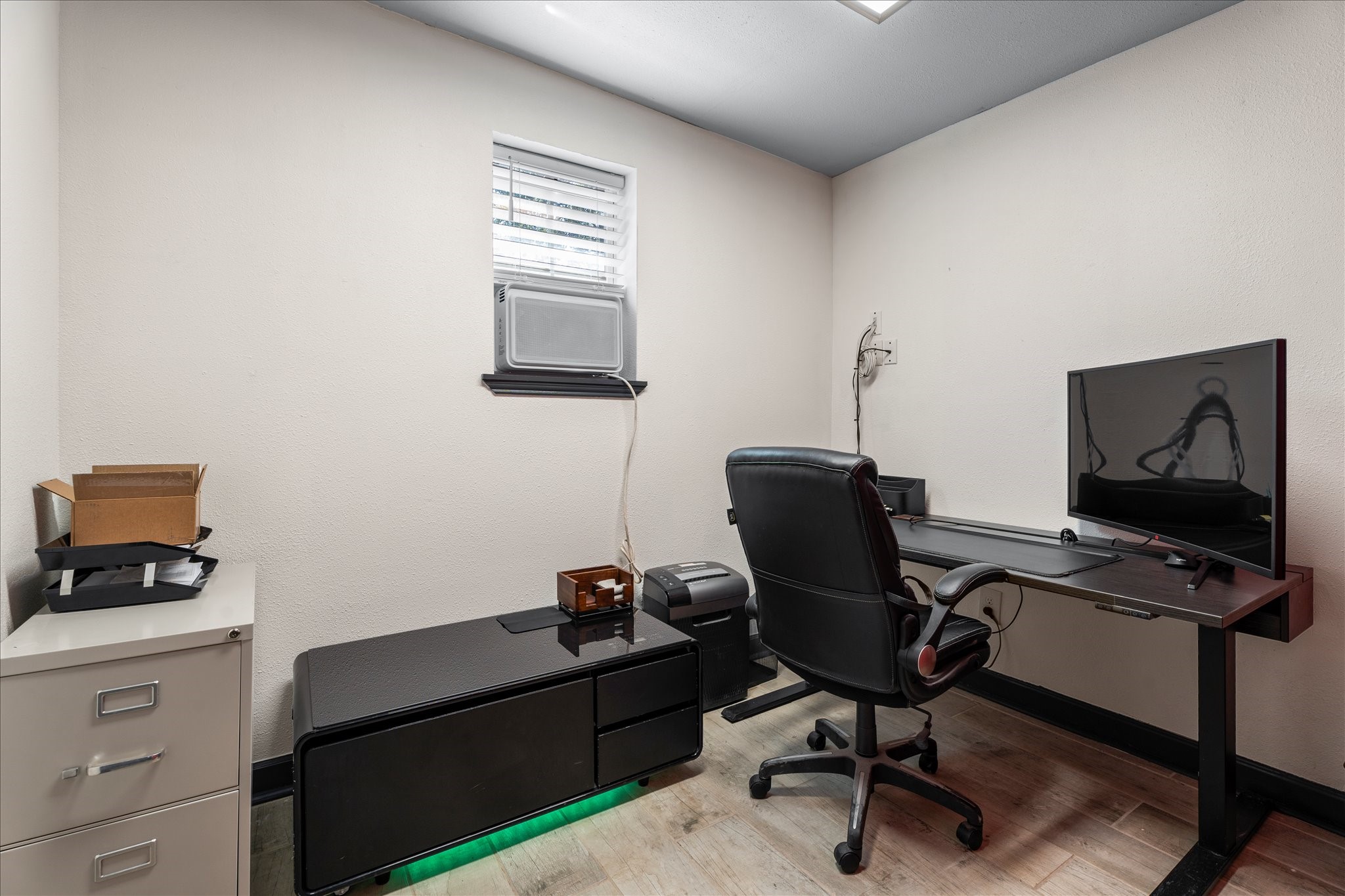 9902 Franklin Road Houston, TX 77070 - Photo 21 of 43 a view of a workspace with furniture and a window