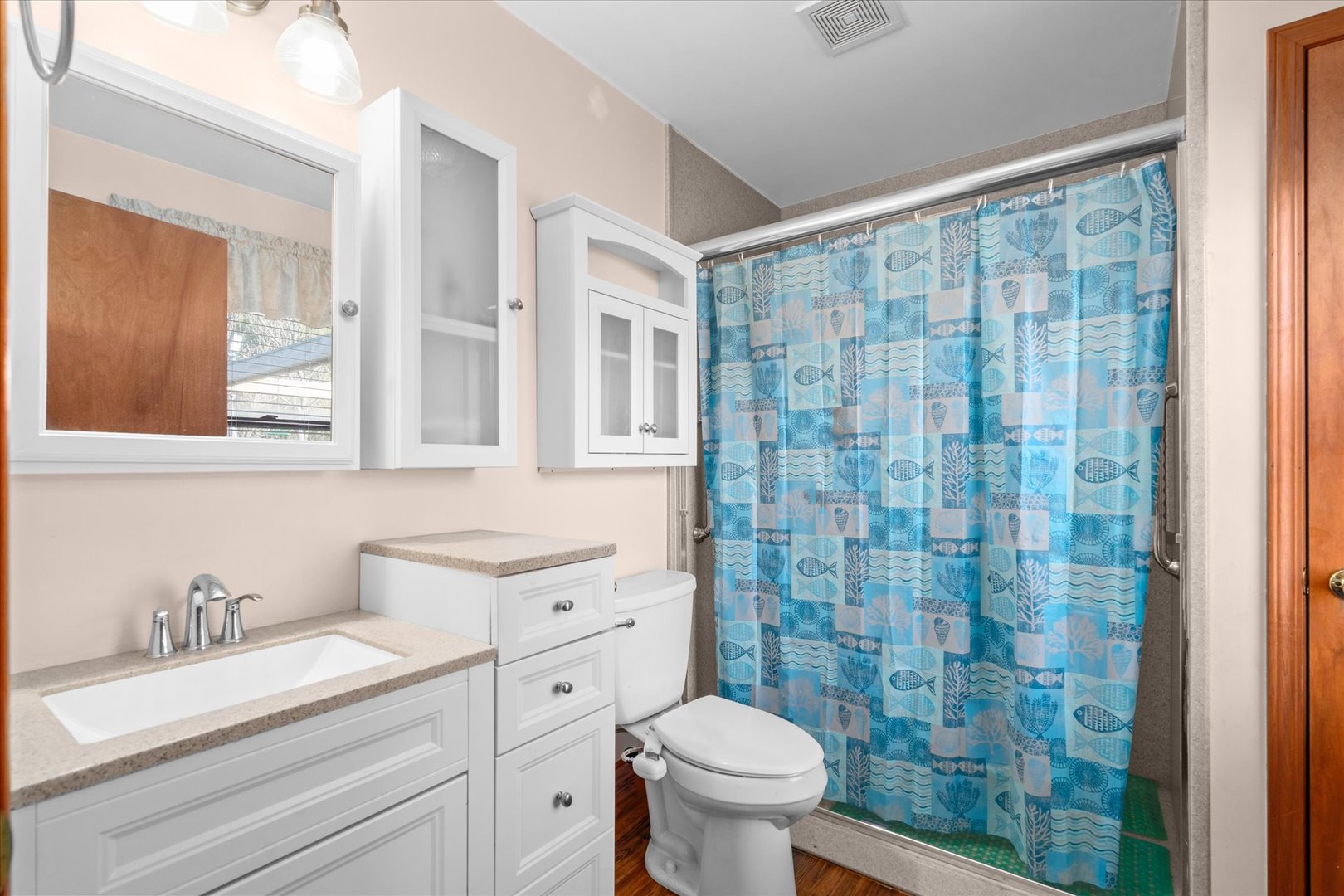 4461 Highway 23 Leland, IL 60531 - Photo 12 of 28 a bathroom with a granite countertop sink a toilet and a shower