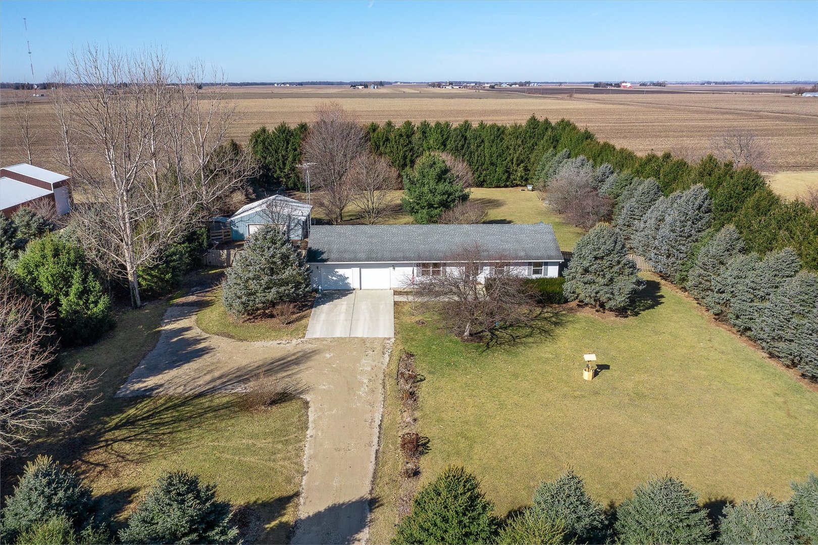 4461 Highway 23 Leland, IL 60531 - Photo 2 of 28 a view of a lake with a mountain in the back