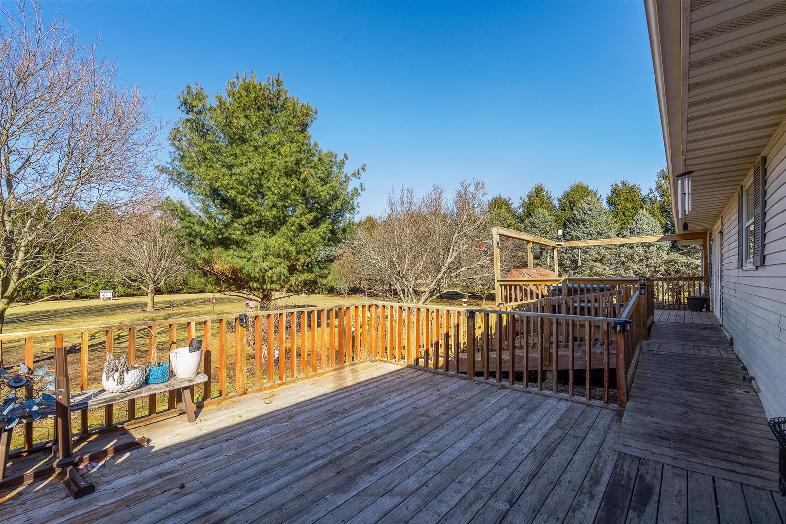 4461 Highway 23 Leland, IL 60531 - Photo 23 of 28 a view of a balcony with wooden floor and fence