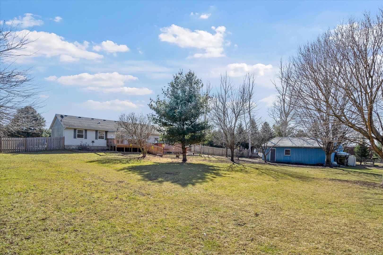 4461 Highway 23 Leland, IL 60531 - Photo 25 of 28 a view of a house with swimming pool and a yard