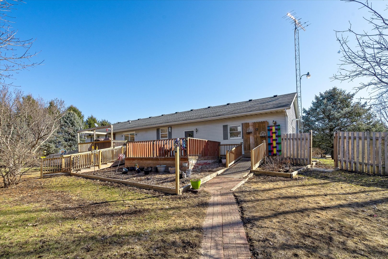 4461 Highway 23 Leland, IL 60531 - Photo 26 of 28 a view of a house with a large trees and wooden fence