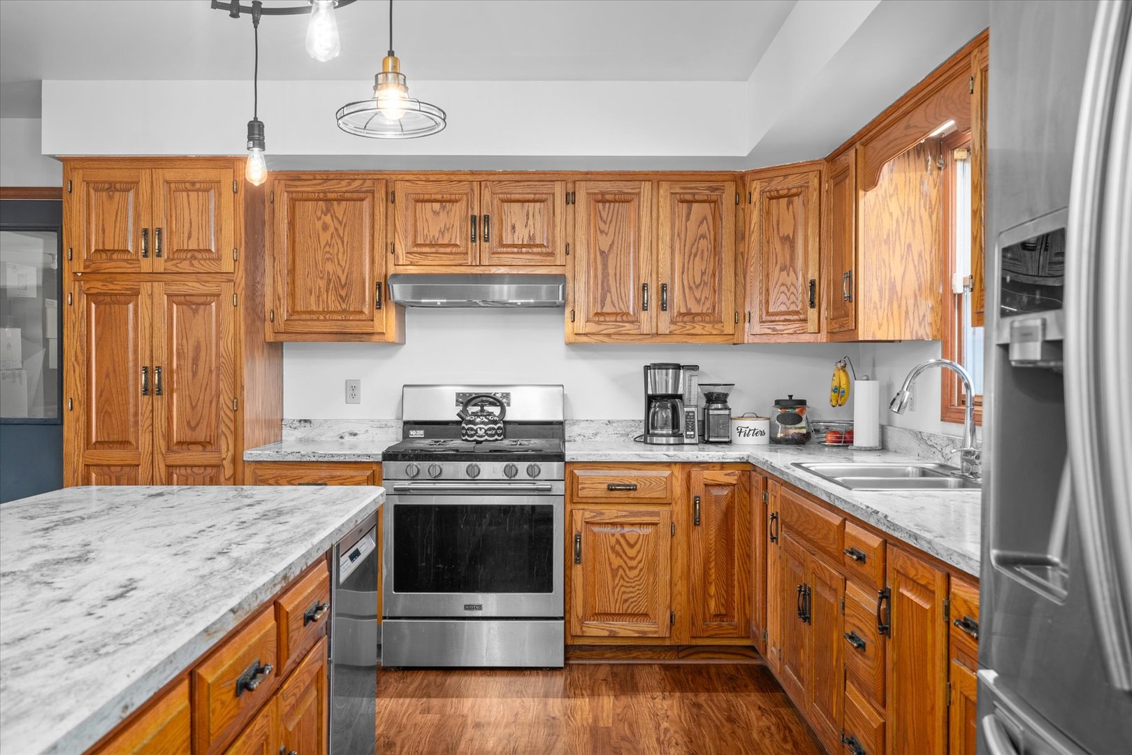 4461 Highway 23 Leland, IL 60531 - Photo 9 of 28 a kitchen with stainless steel appliances granite countertop a stove a sink dishwasher and a refrigerator
