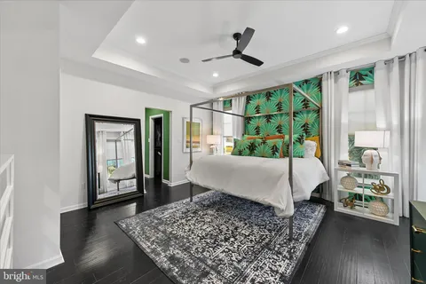 a bedroom with furniture and flat screen tv