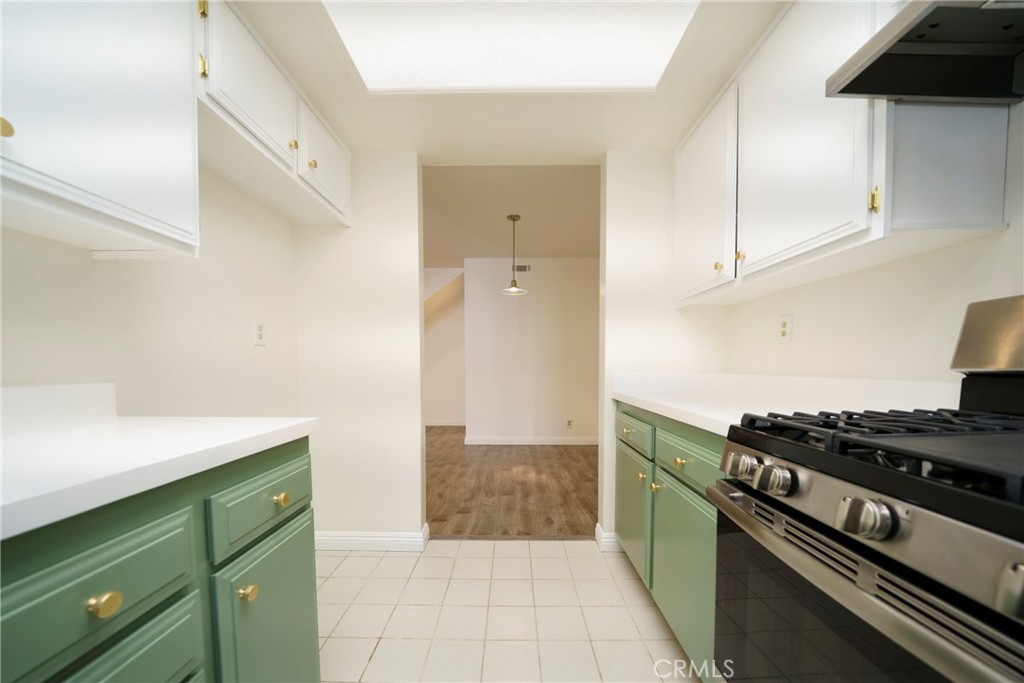 10663 Bell Street Stanton, CA 90680 - Photo 13 of 38 a kitchen with a stove and a cabinets