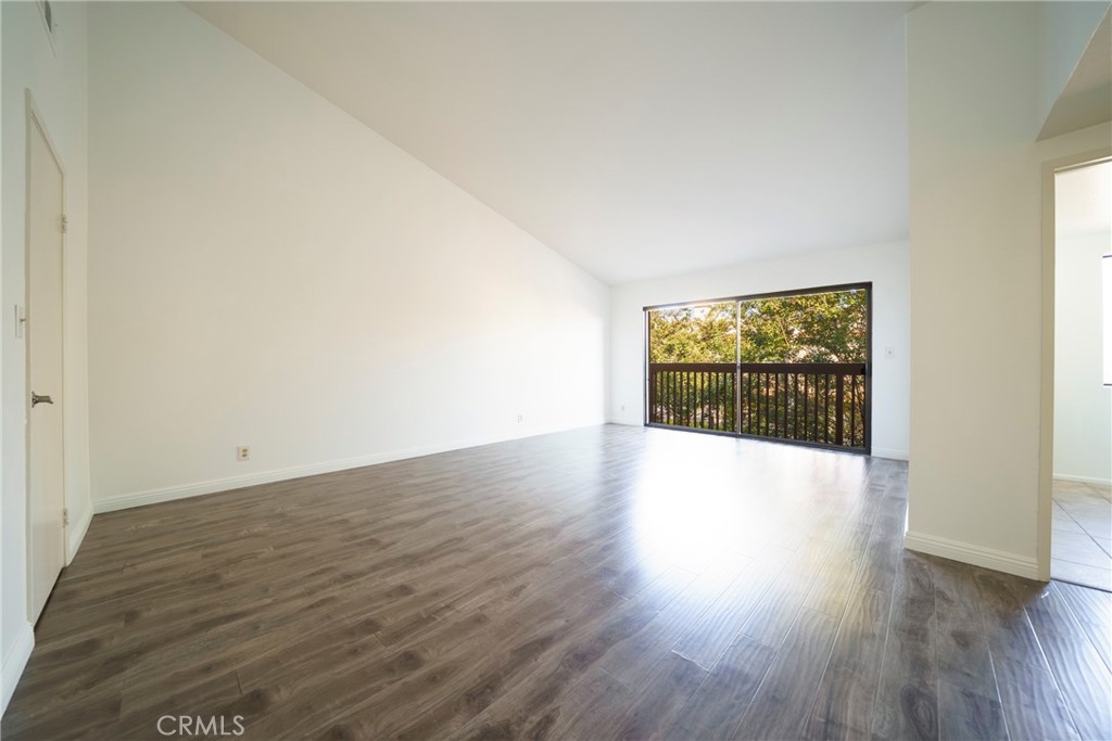 10663 Bell Street Stanton, CA 90680 - Photo 22 of 38 a view of an empty room and wooden floor
