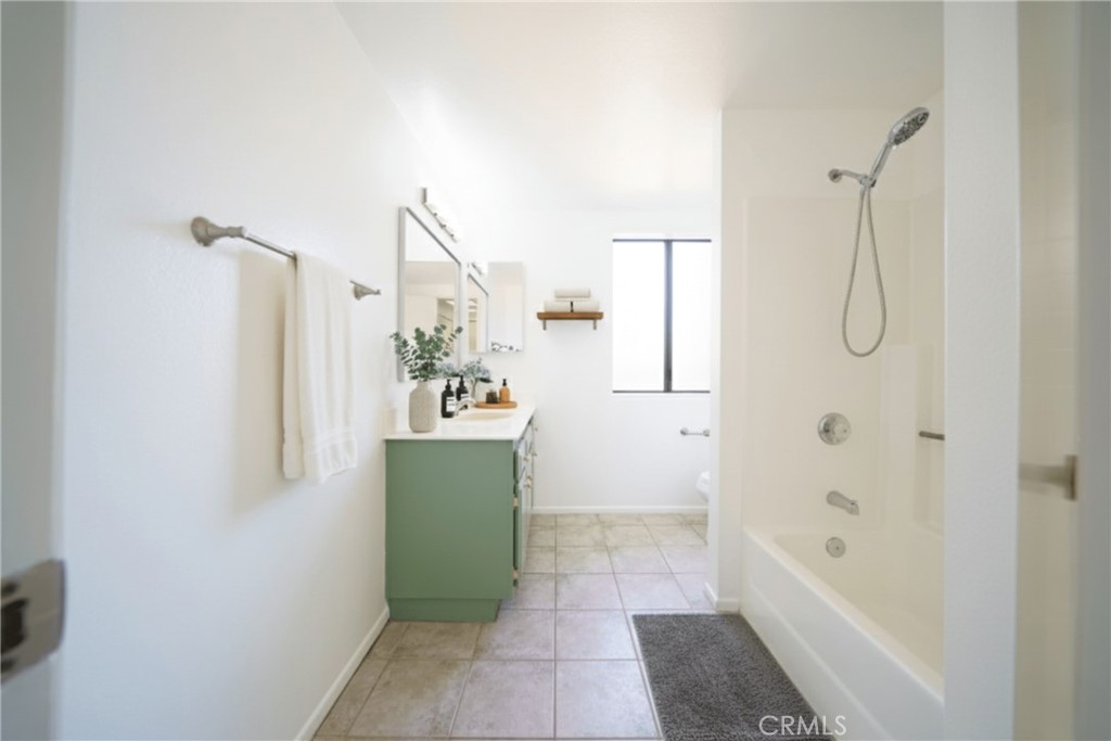 10663 Bell Street Stanton, CA 90680 - Photo 25 of 38 a bathroom with a bathtub sink and mirror