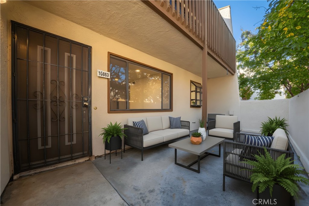 10663 Bell Street Stanton, CA 90680 - Photo 29 of 38 a living room with furniture and a potted plant