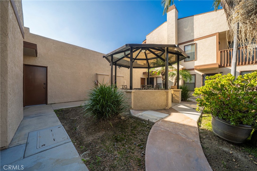 10663 Bell Street Stanton, CA 90680 - Photo 35 of 38 a view of a house with a yard