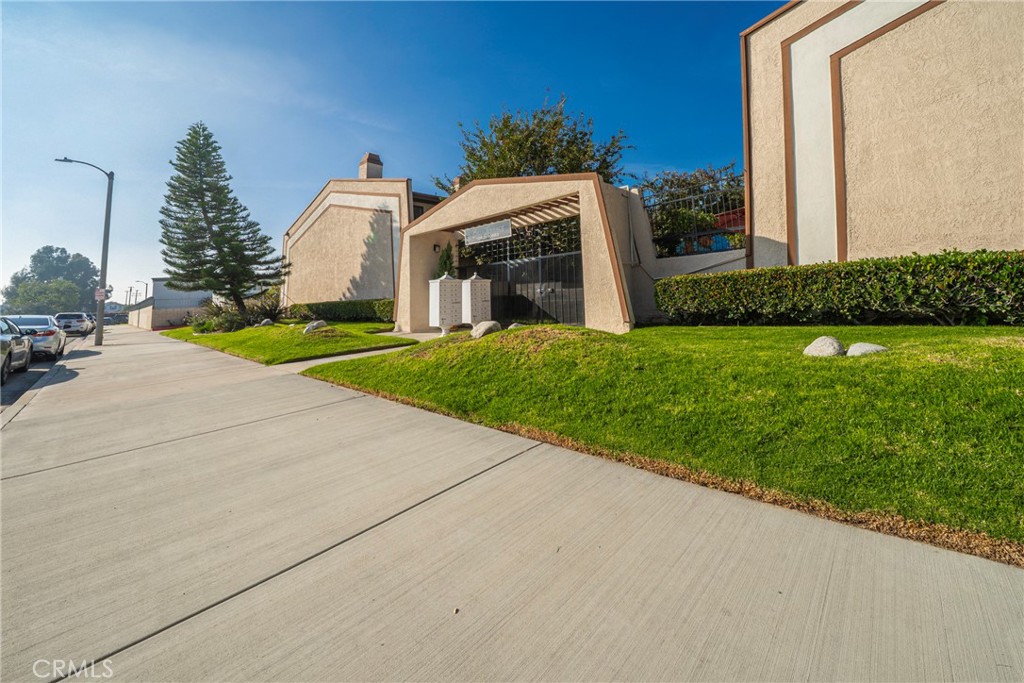 10663 Bell Street Stanton, CA 90680 - Photo 36 of 38 a view of a house with backyard and a garden