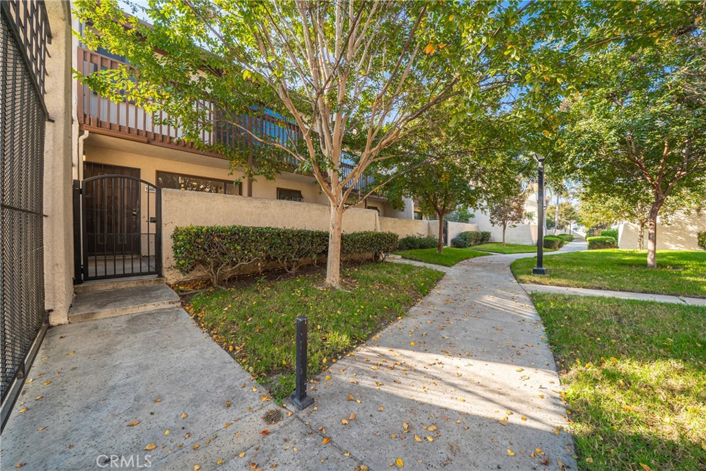 10663 Bell Street Stanton, CA 90680 - Photo 4 of 38 a view of a yard with plants and trees