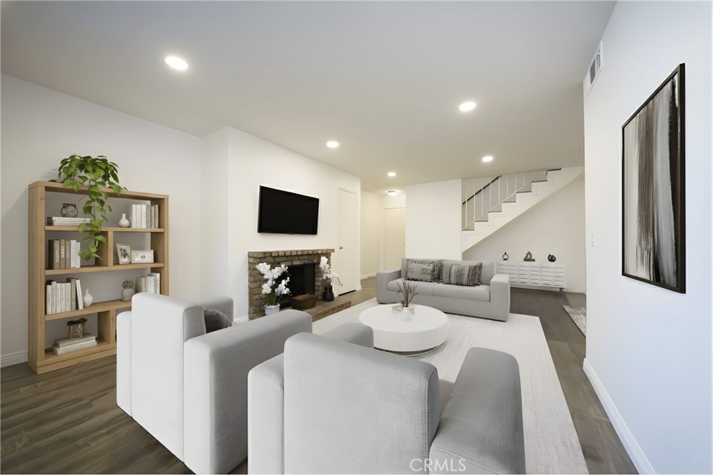 10663 Bell Street Stanton, CA 90680 - Photo 5 of 38 a living room with furniture and a flat screen tv