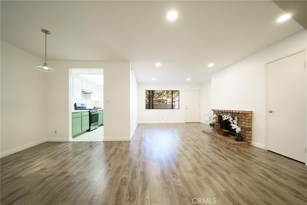 10663 Bell Street Stanton, CA 90680 - Photo 9 of 38 a view of a kitchen with a sink and a wooden floor