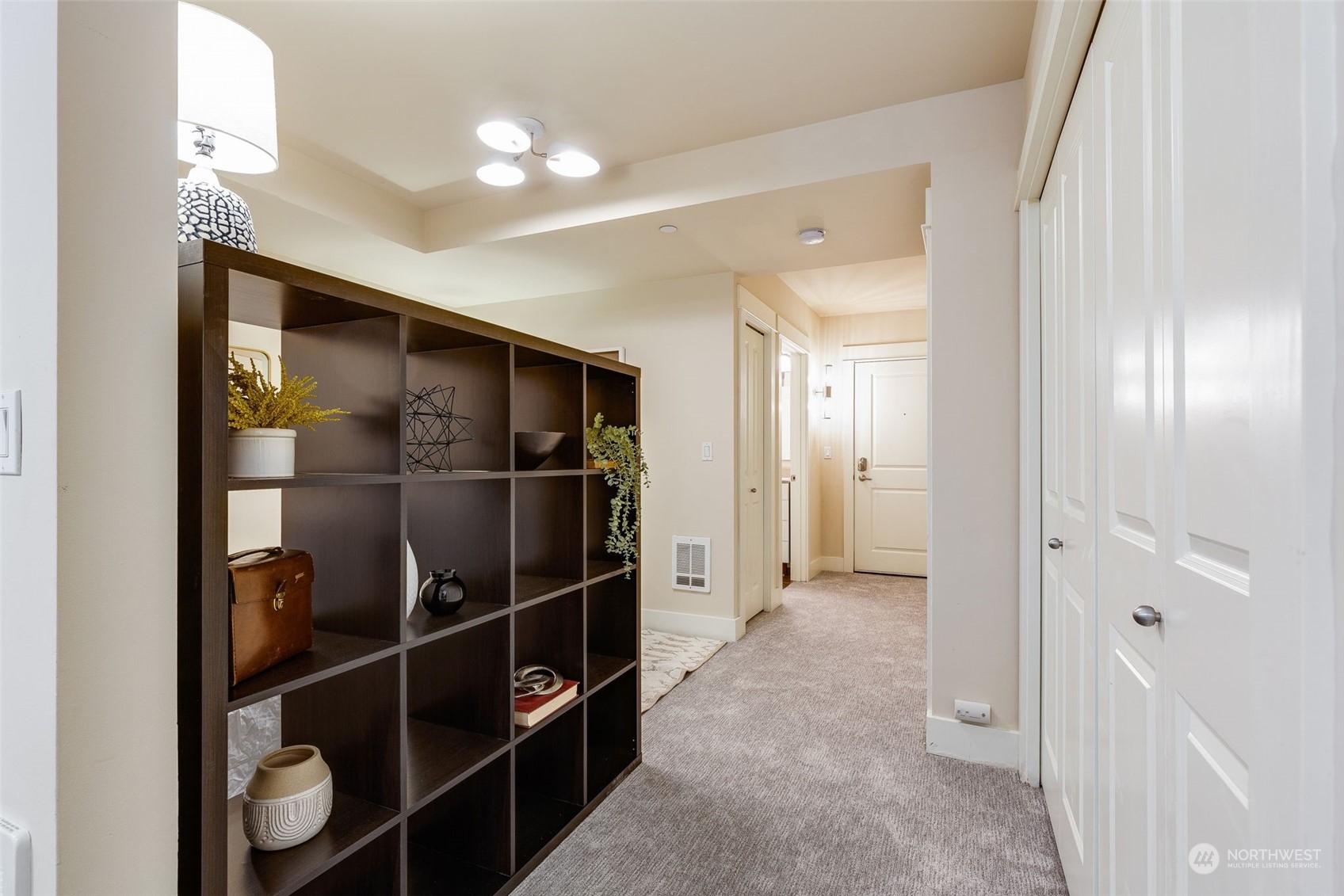 699 John Street, Unit 209 Seattle, WA 98109 - Photo 14 of 28 a view of empty room with wooden floor and windows