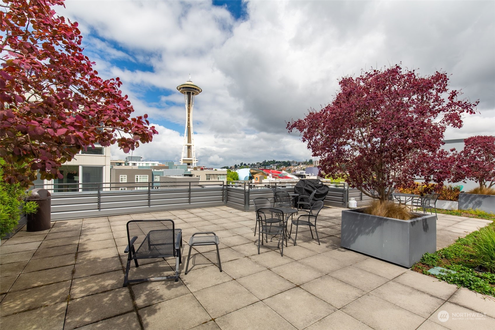 699 John Street, Unit 209 Seattle, WA 98109 - Photo 20 of 28 a view of a tables and chairs in the patio
