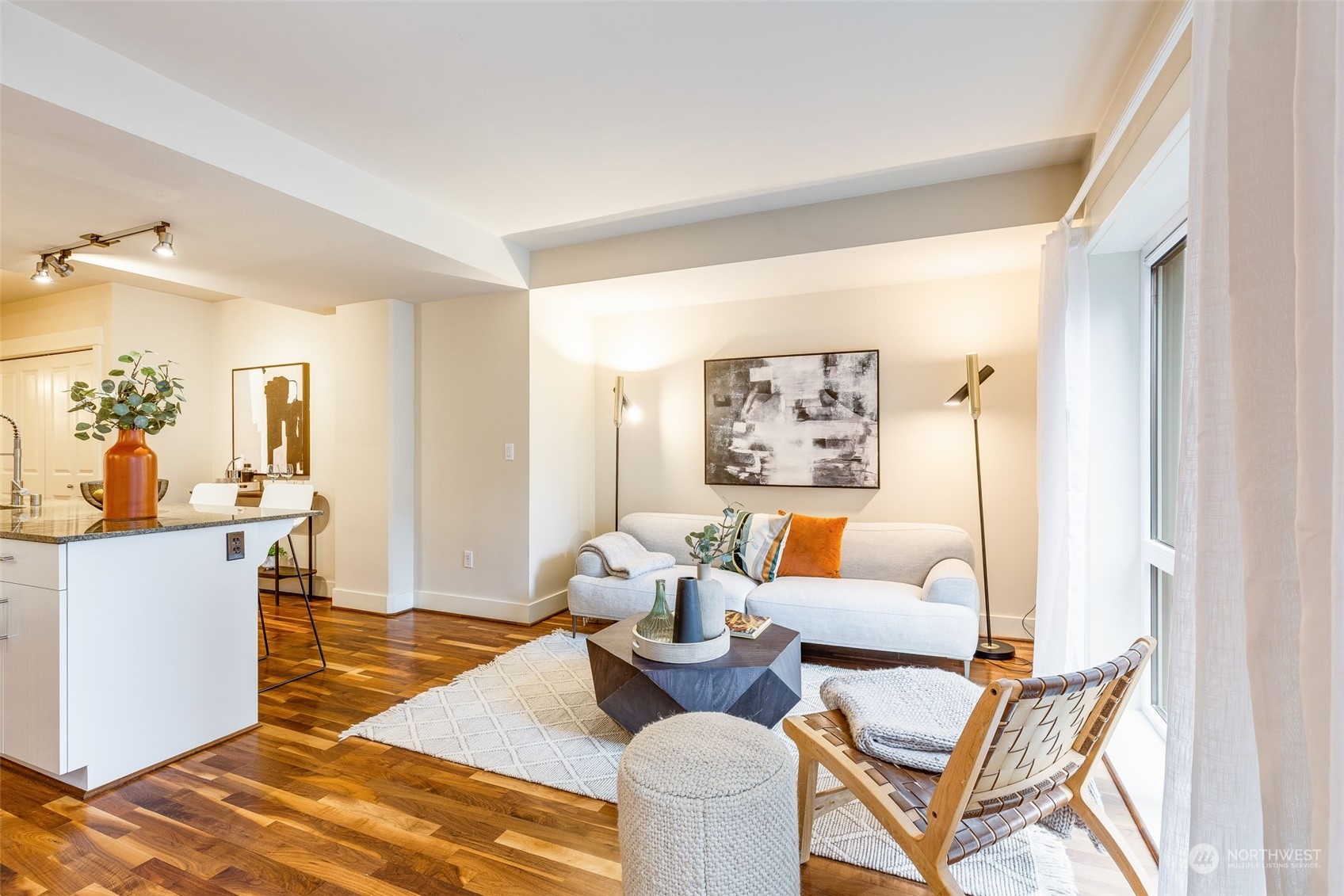 699 John Street, Unit 209 Seattle, WA 98109 - Photo 6 of 28 a living room with furniture and wooden floor