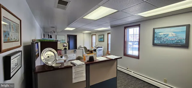 a workspace with furniture and window