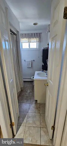 a view of living room with furniture and a window