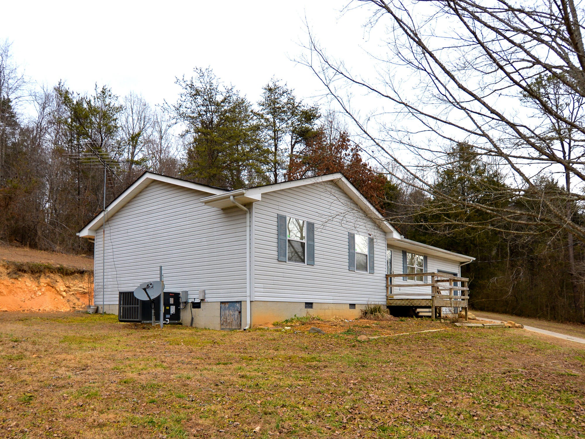6762 Ross Road Philadelphia, TN 37846 - Photo 2 of 14 a view of a house with backyard and trees