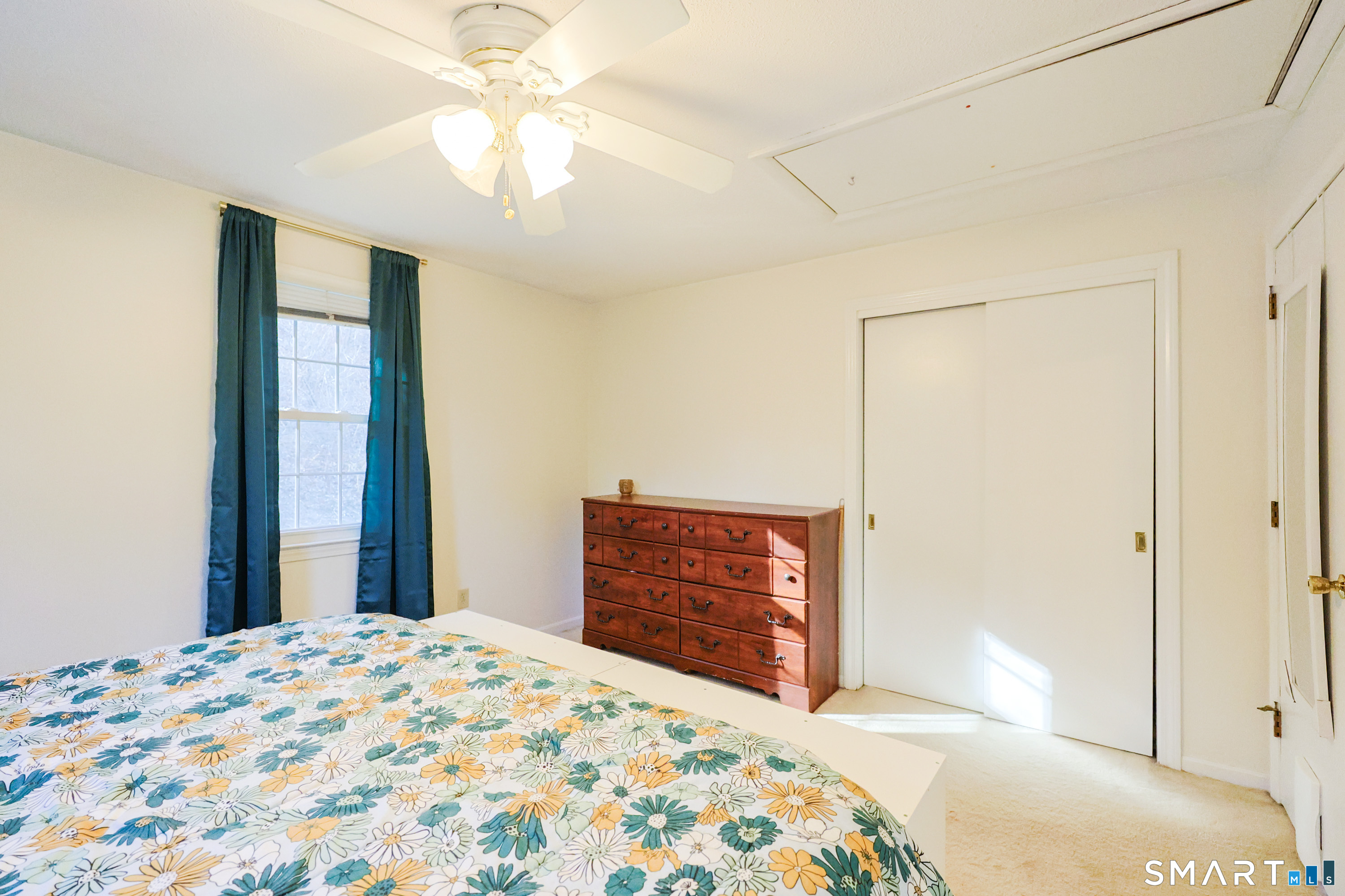 80 Sabin Street Putnam, CT 06260 - Photo 12 of 26 a bedroom with a bed and a dresser