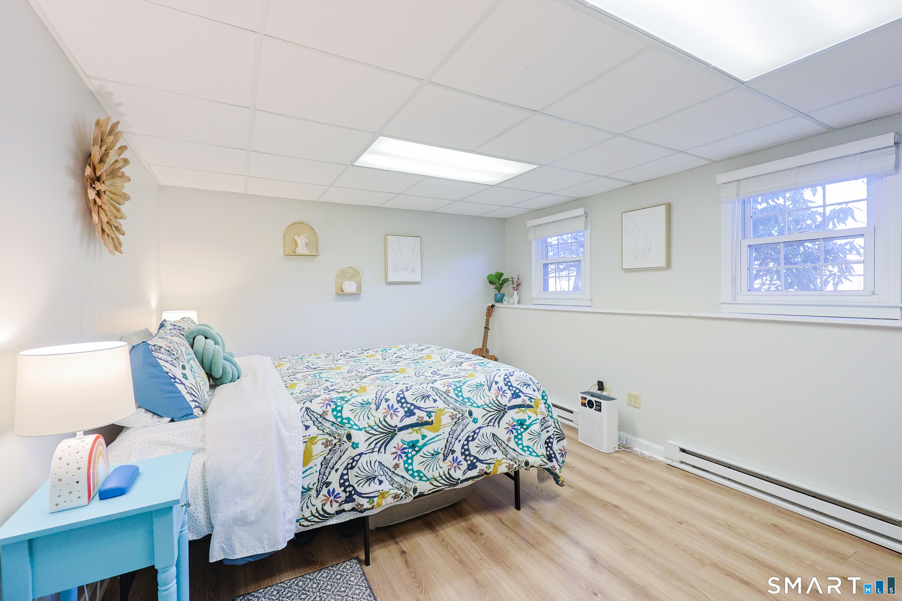 80 Sabin Street Putnam, CT 06260 - Photo 13 of 26 a bedroom with a bed and a window