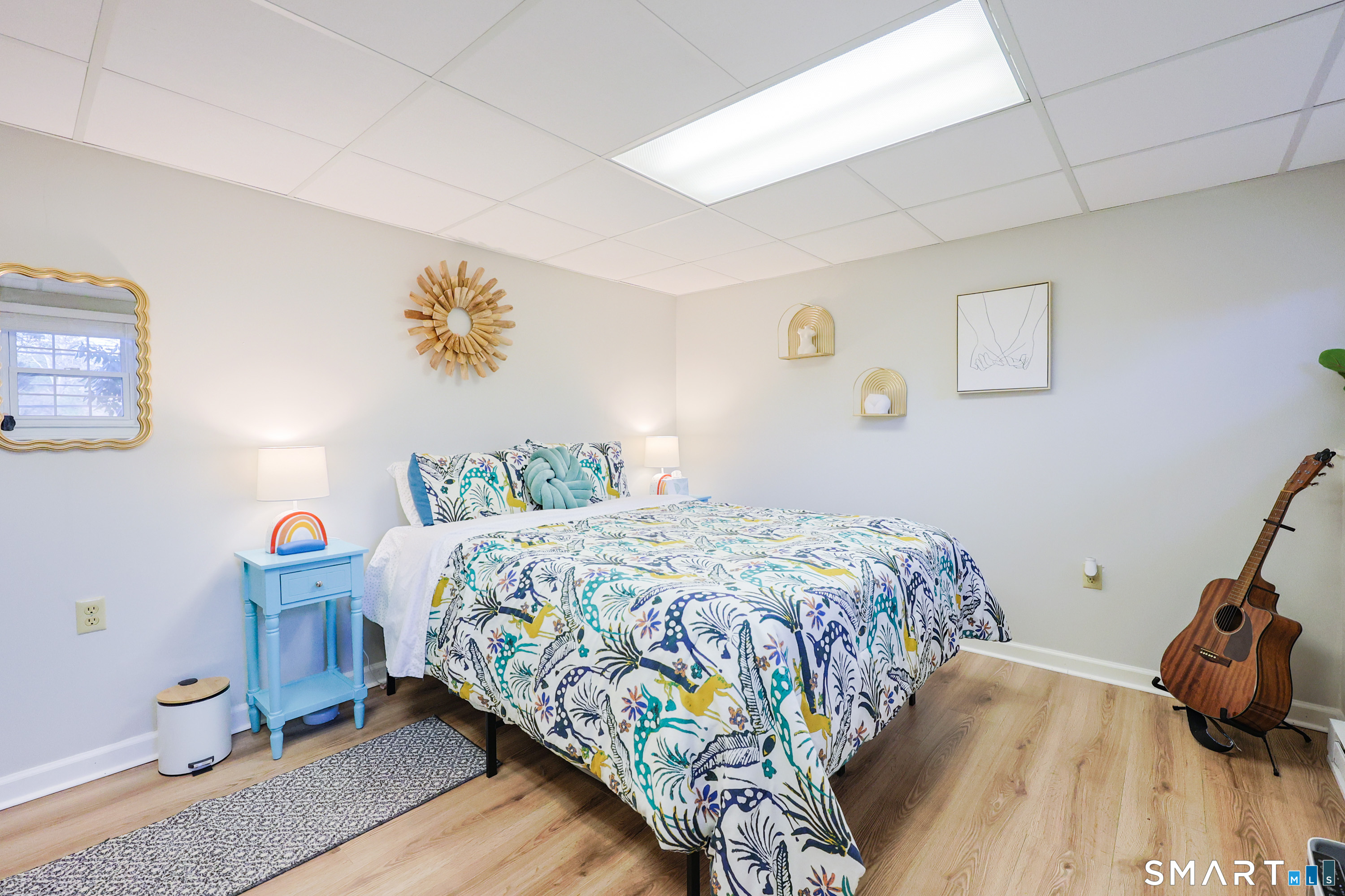 80 Sabin Street Putnam, CT 06260 - Photo 14 of 26 a bedroom with a bed and wooden floor