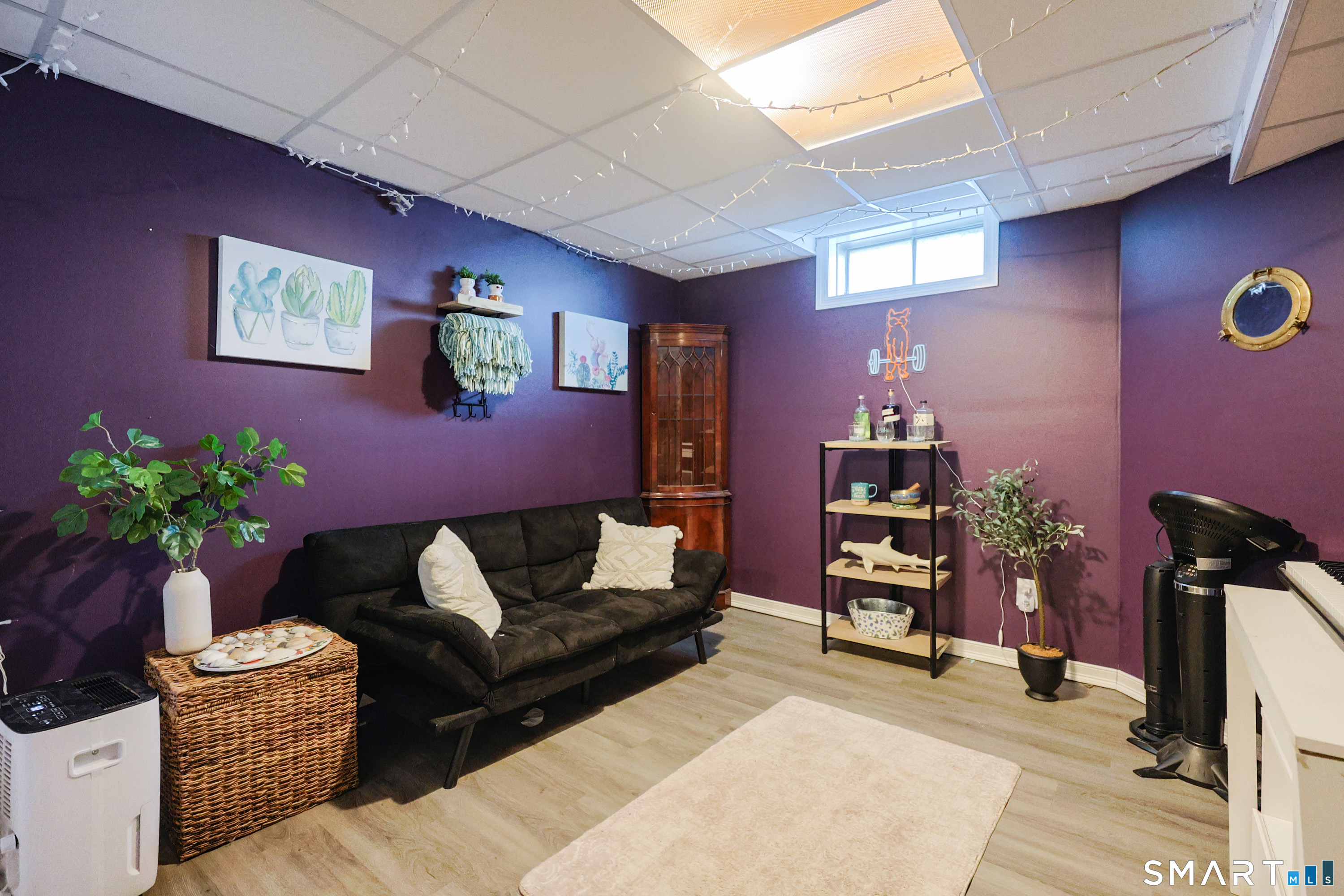 80 Sabin Street Putnam, CT 06260 - Photo 16 of 26 a living room with furniture potted plant and a window