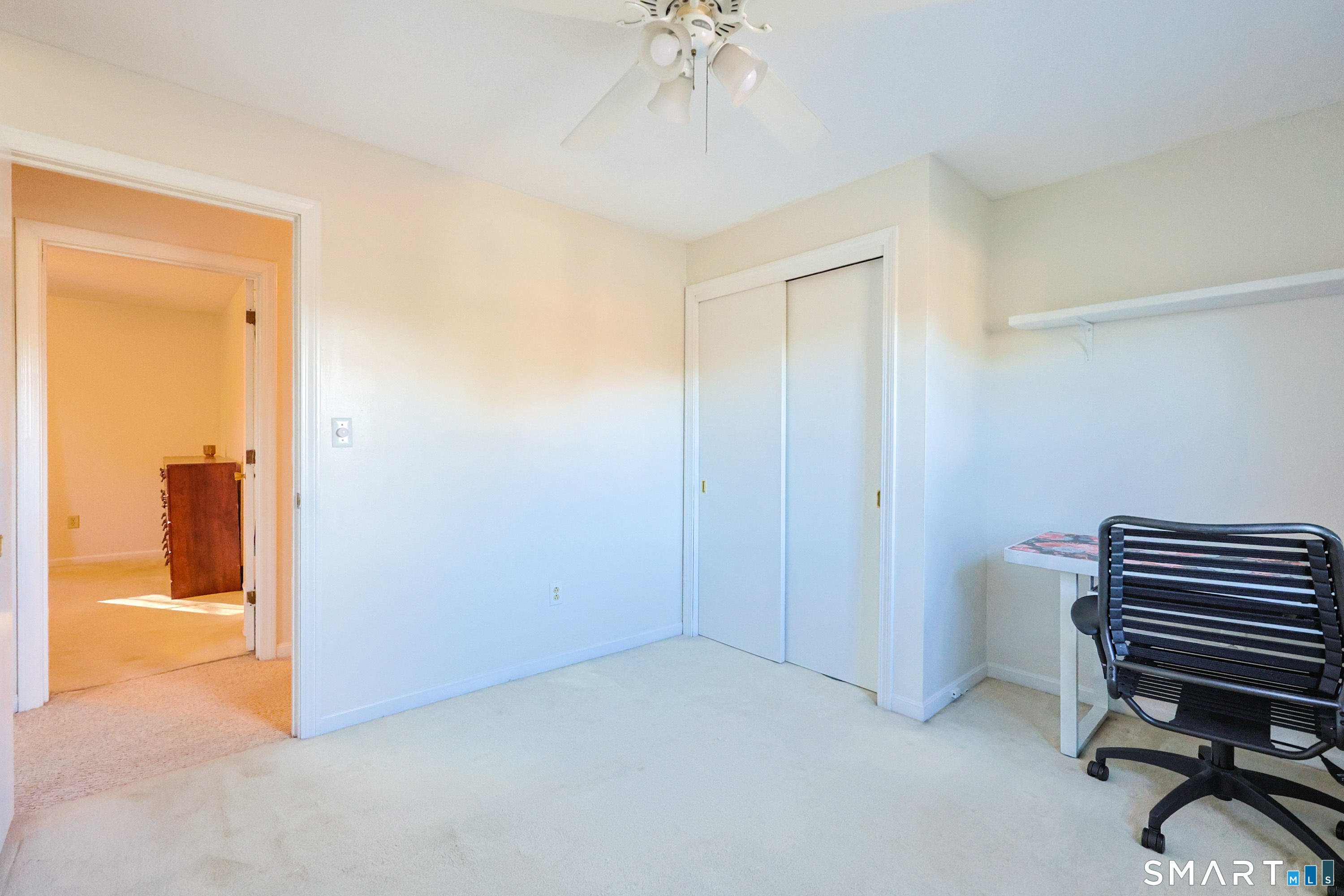 80 Sabin Street Putnam, CT 06260 - Photo 21 of 26 a view of room with workspace and a chandelier fan