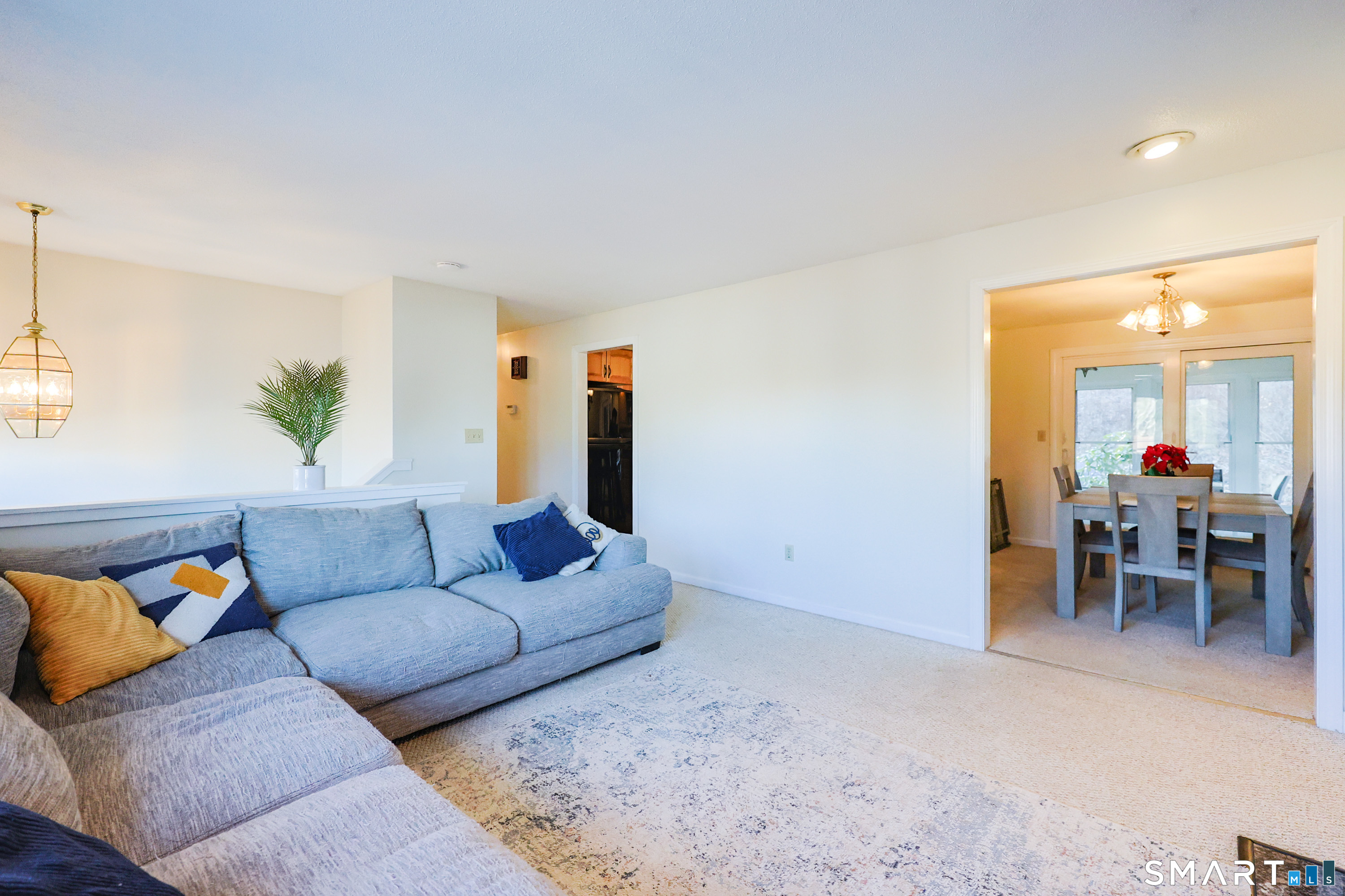 80 Sabin Street Putnam, CT 06260 - Photo 4 of 26 a living room with furniture and a dining table