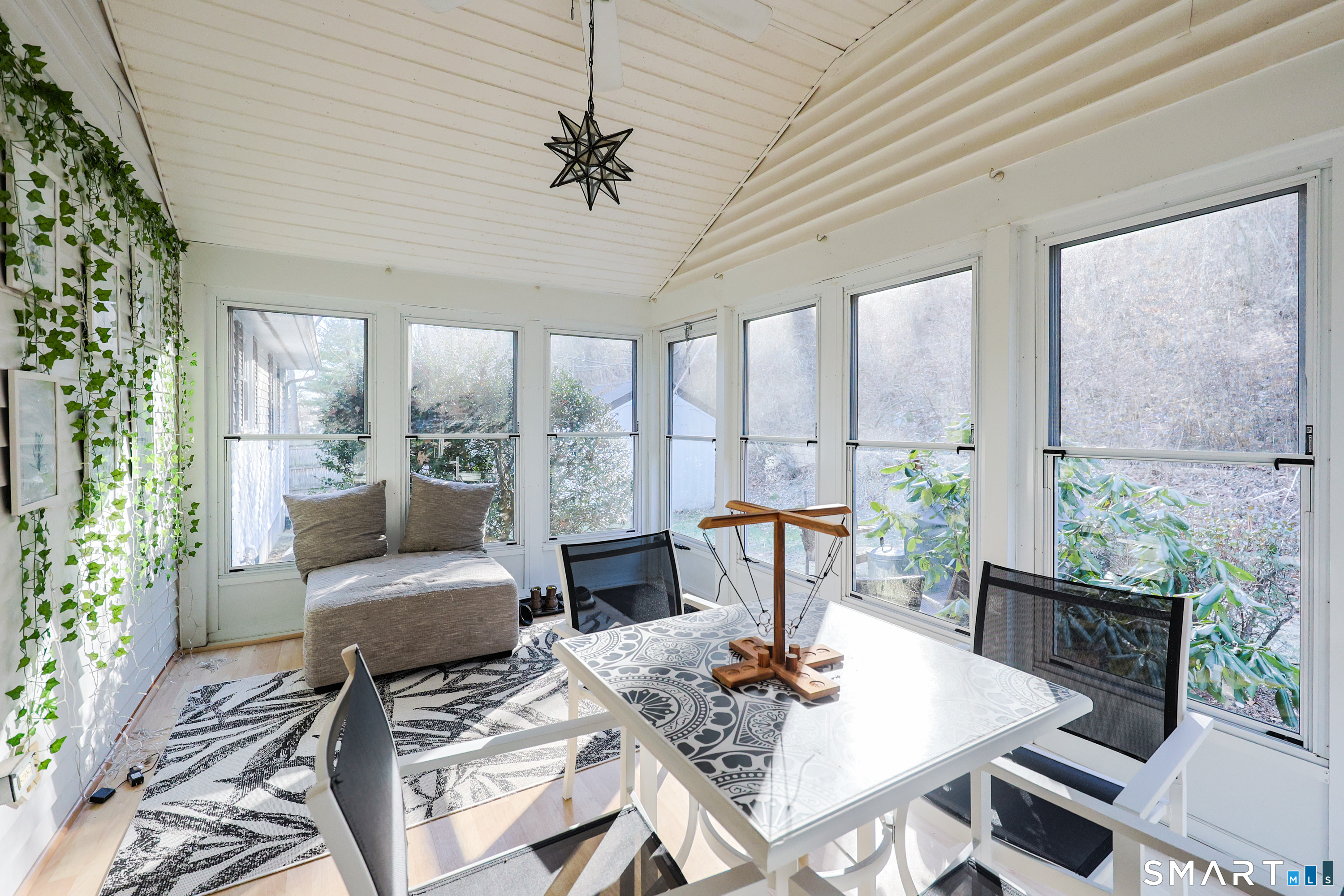80 Sabin Street Putnam, CT 06260 - Photo 5 of 26 a living room with furniture and a large window