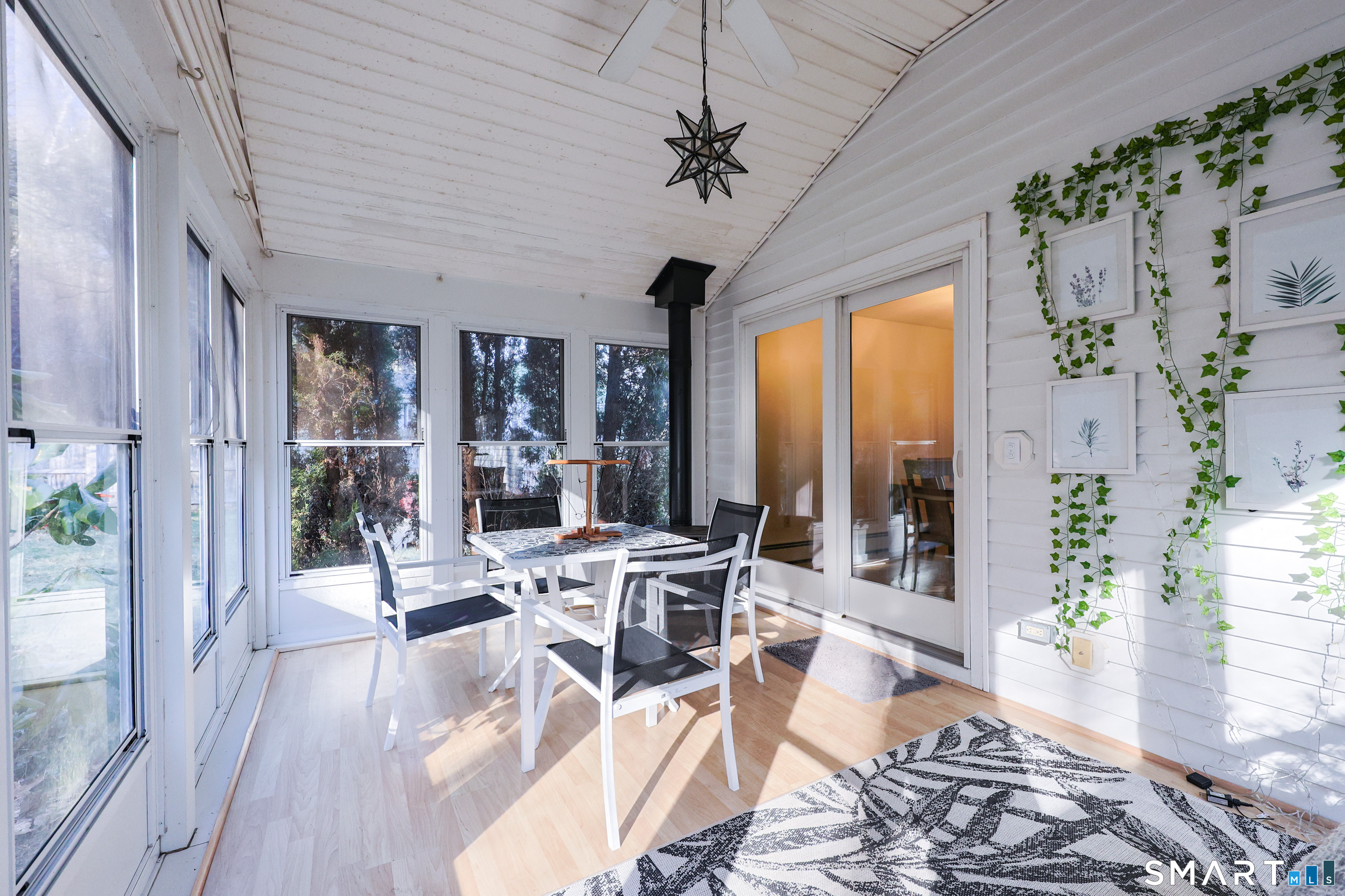 80 Sabin Street Putnam, CT 06260 - Photo 6 of 26 a view of a dining room with furniture wooden floor and chandelier