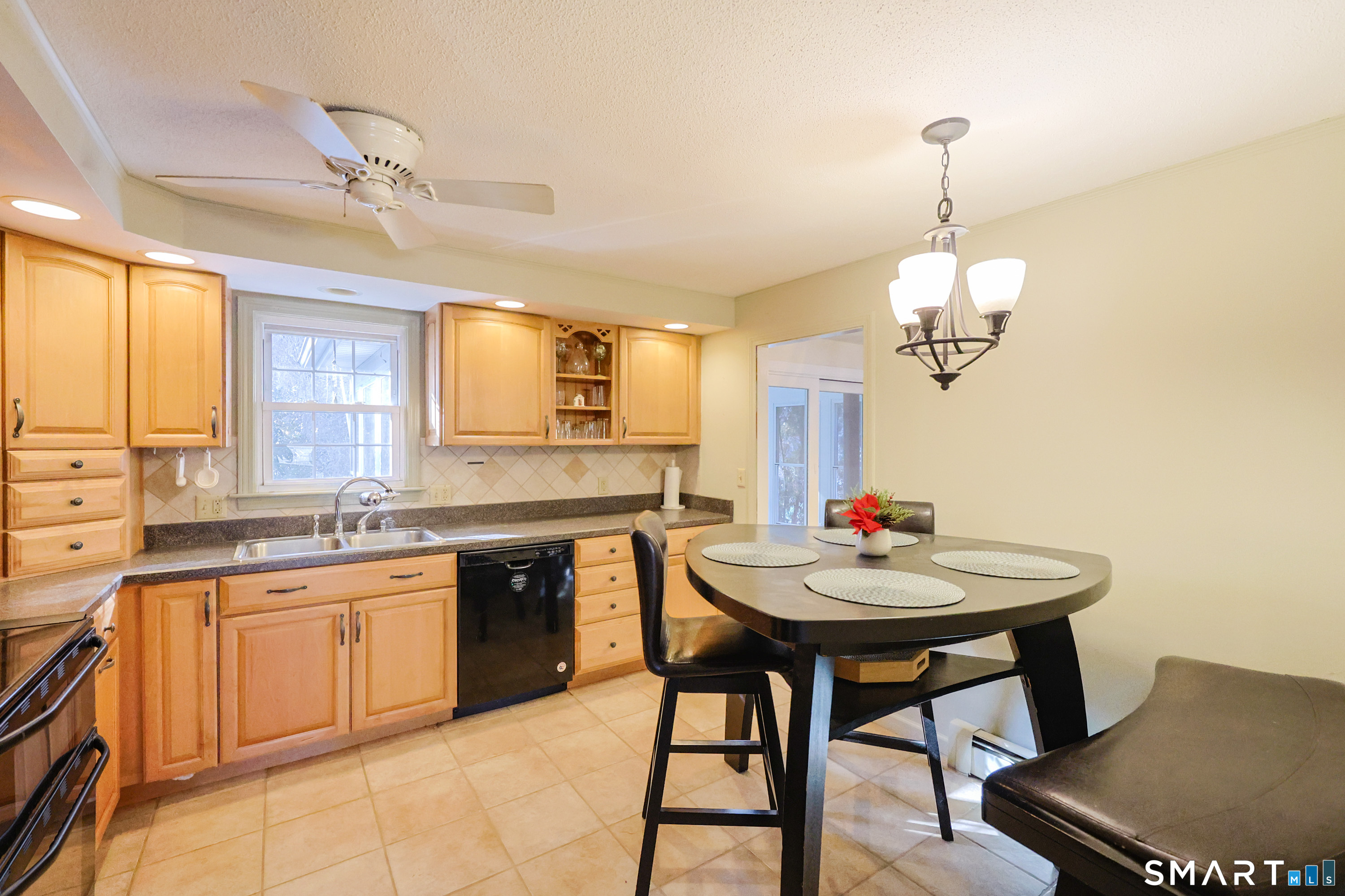 80 Sabin Street Putnam, CT 06260 - Photo 7 of 26 a kitchen with a kitchen island hardwood floor sink and stove