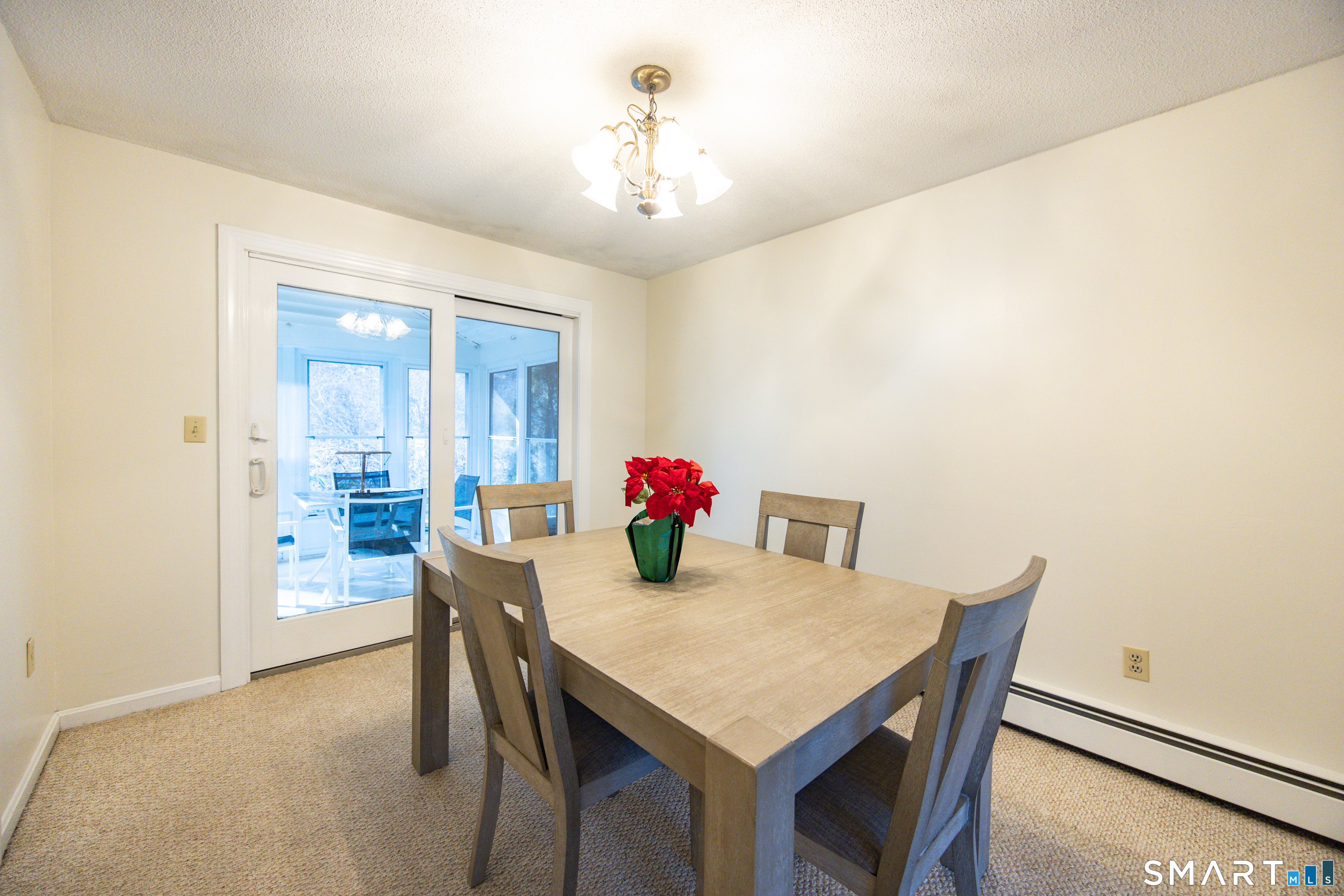 80 Sabin Street Putnam, CT 06260 - Photo 10 of 26 a view of a dining room with furniture and chandelier