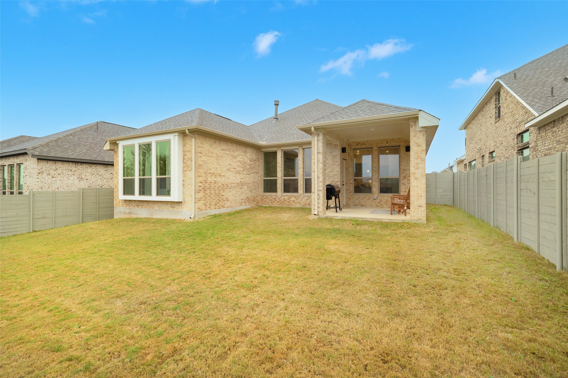1117 Spring Gulch Lane Georgetown, TX 78628 - Photo 38 of 39 A spacious backyard with an inviting covered patio for outdoor enjoyment.
