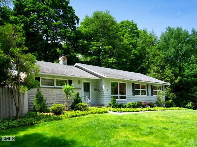 23 Huckleberry Lane Ridgefield, CT 06877 - Photo 1 of 1 a view of a house with a yard potted plants and large tree